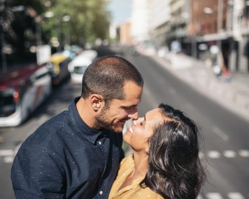 Smiling couple of lovers having fun in the street.